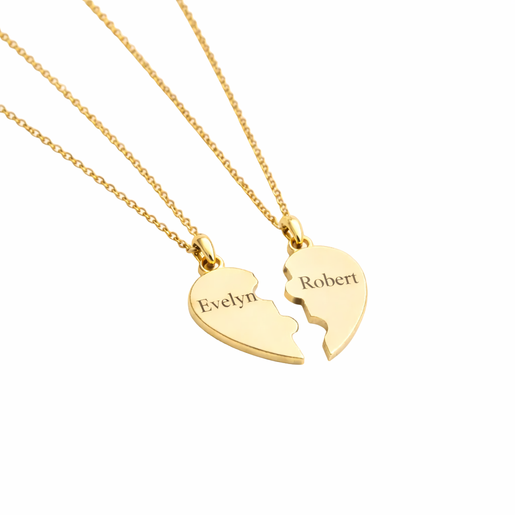 Gold heart-shaped pendant with engraved names on a white background